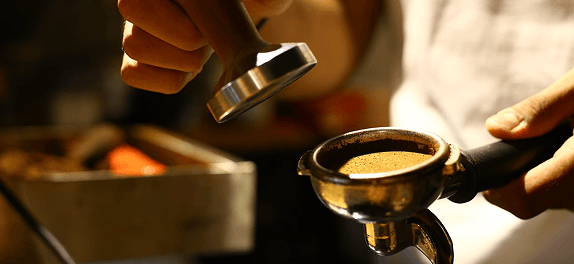 Barista preparing coffee at the Gcore booth